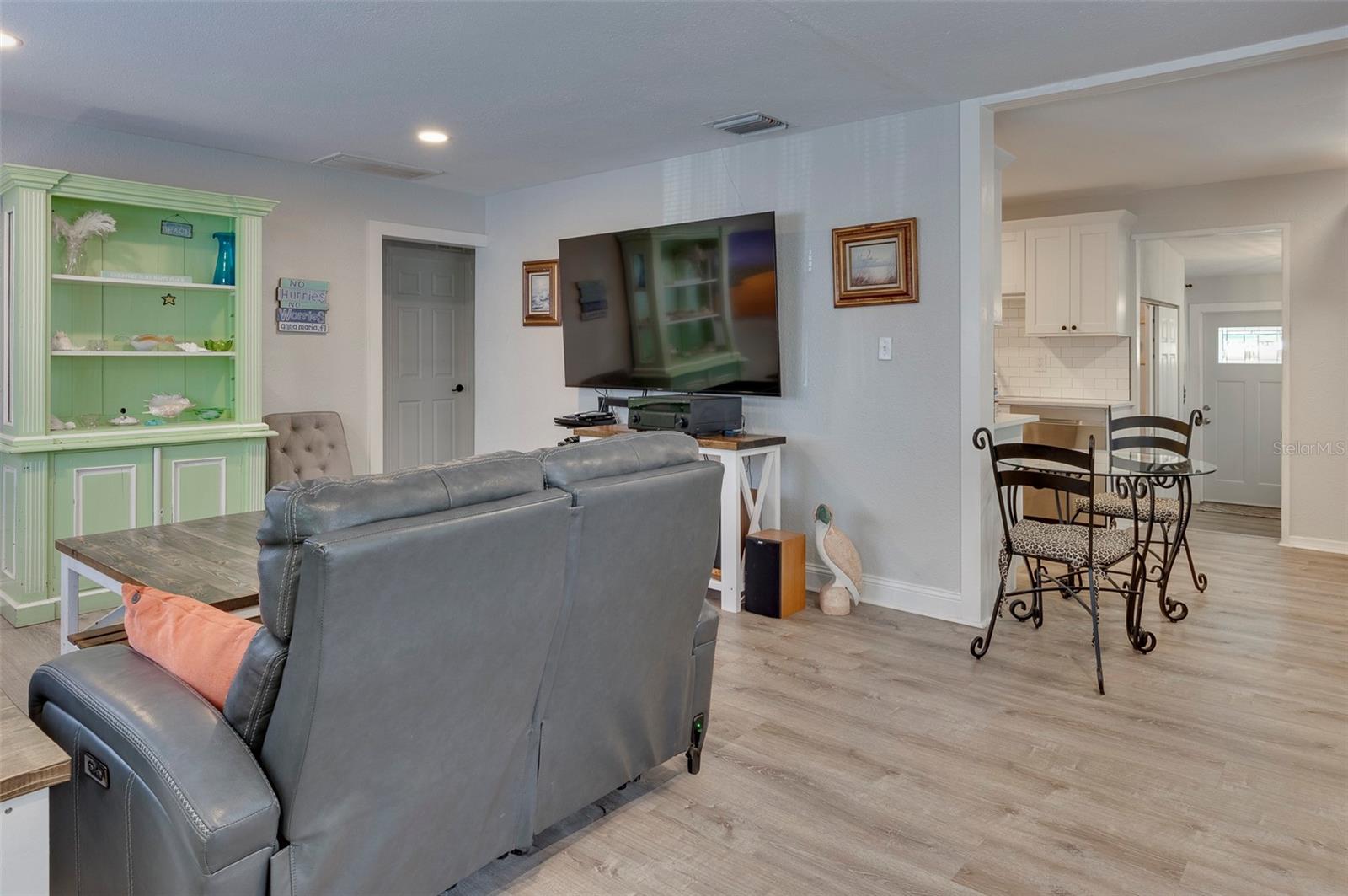 View from the front entrance, living space to the left, kitchen directly ahead