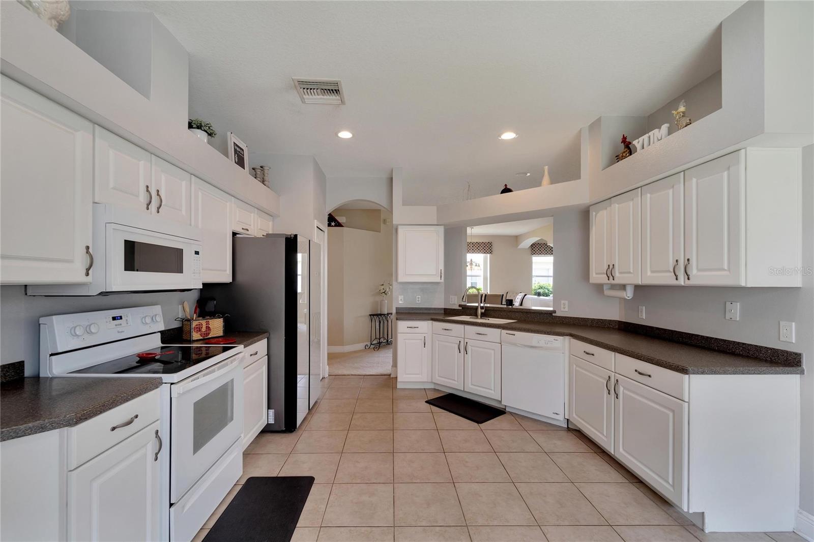 Kitchen with new refridgerator and microwave