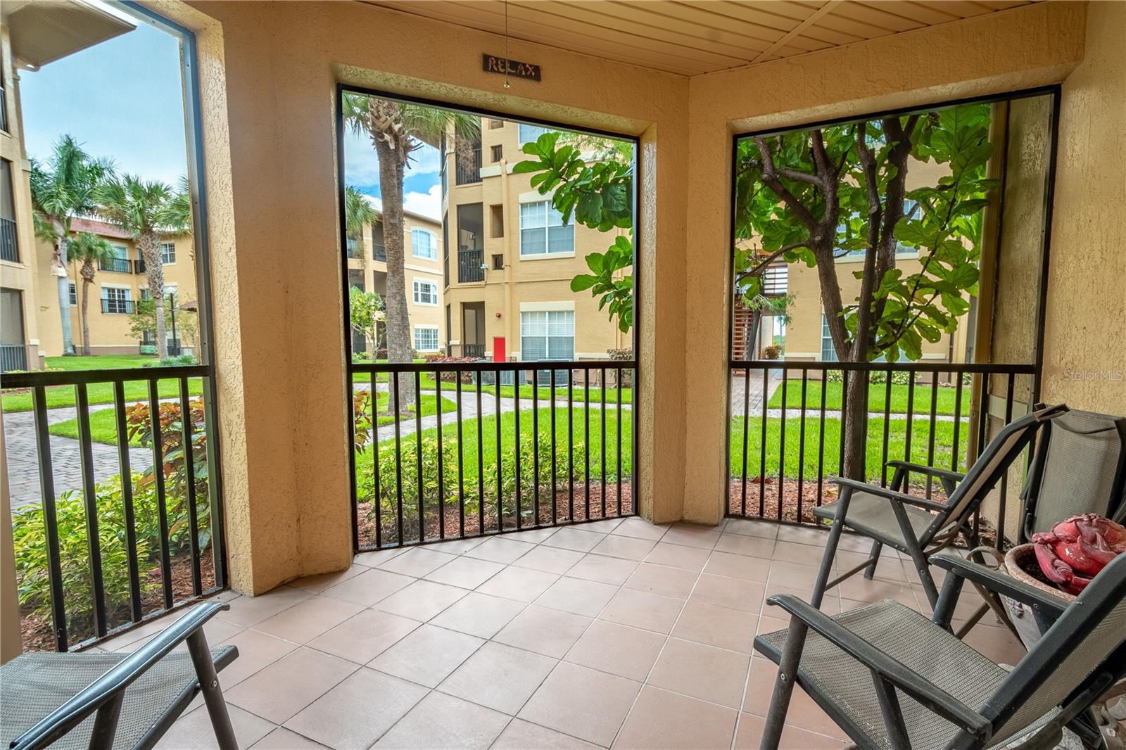 The unit features a screen in porch with a tile floor.