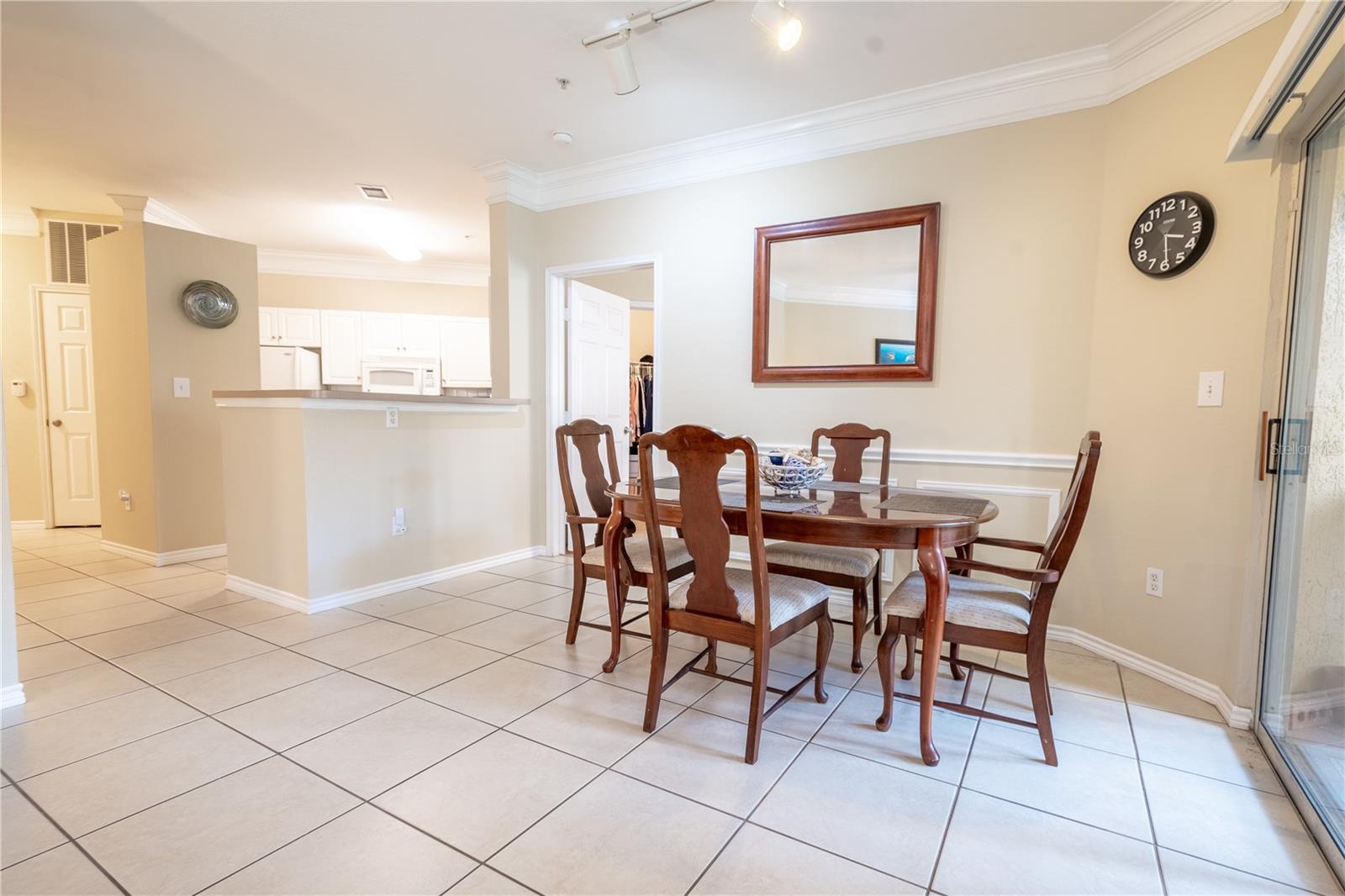 The spacious dining area is conveniently located next to the kitchen.