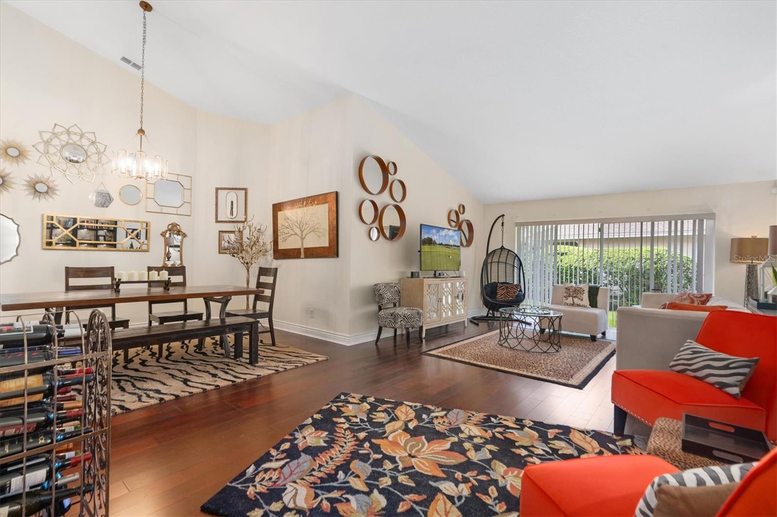 Living Room w/ Cathedral Ceilings Open to Formal Dining Room