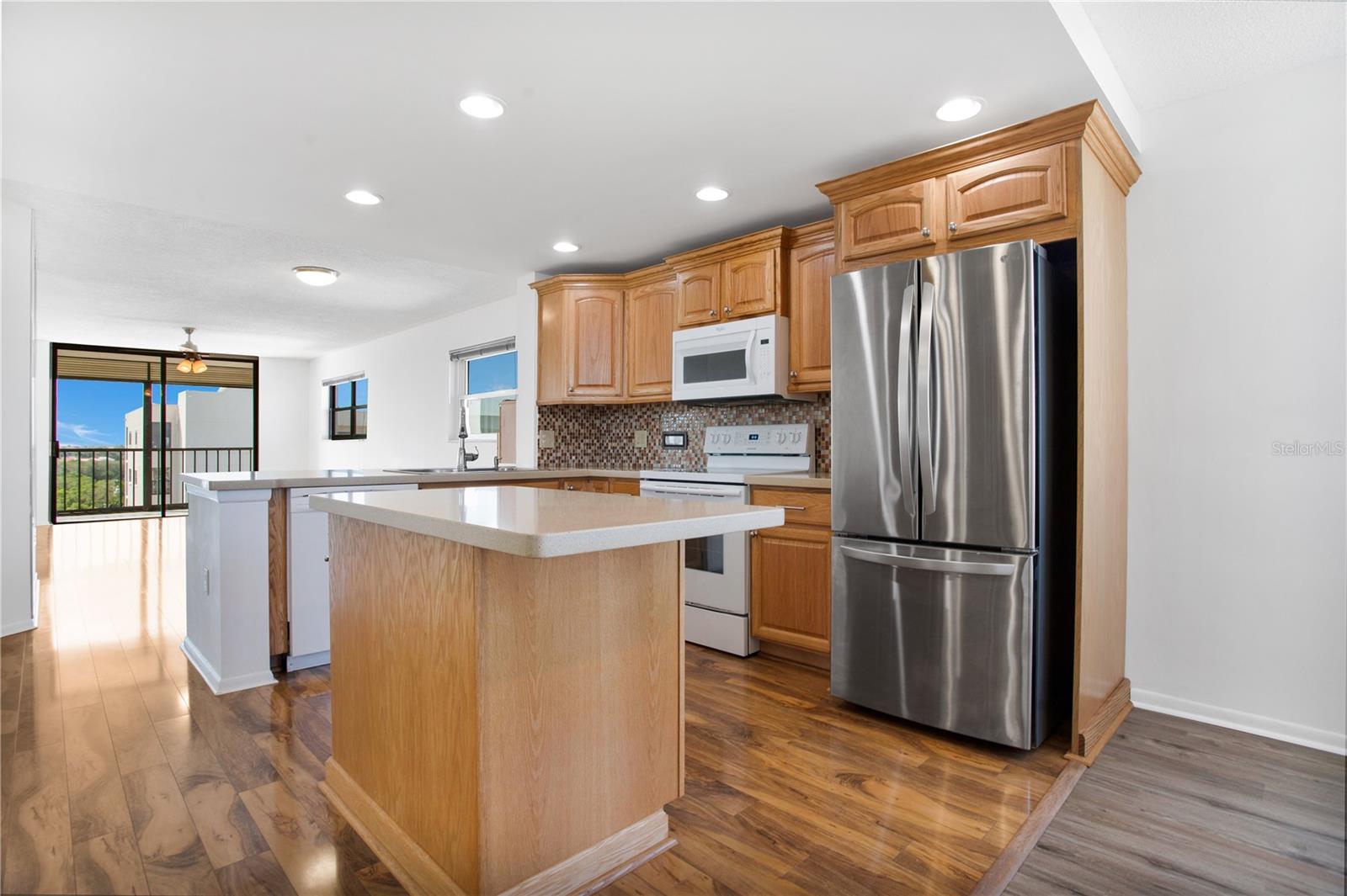 Open kitchen makes all the difference and extra windows flood the space with natural light