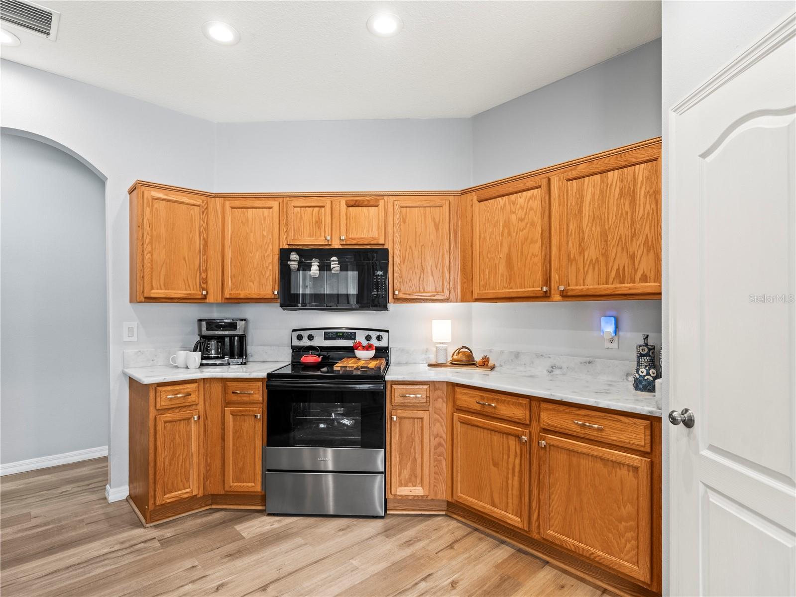 With a pantry, an abundance of cabinets and drawers with new hardware, new range, and new counters, you'll enjoy entertaining for small or large celebrations!