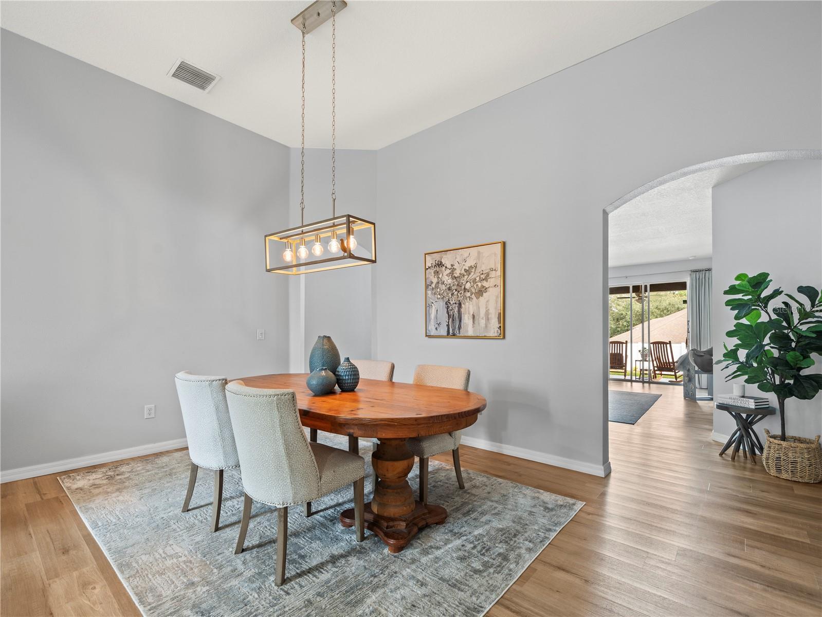 Formal Dining room with easy transition to your family room, kitchen, and triple split bedrooms.