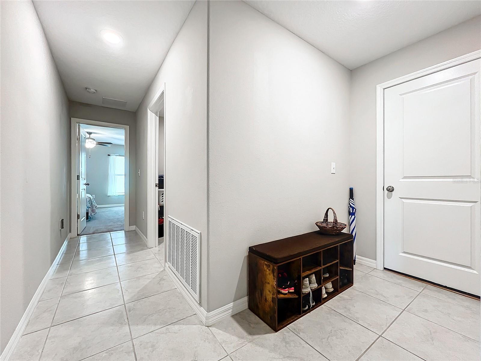 Hallway toward Garage & Room 4