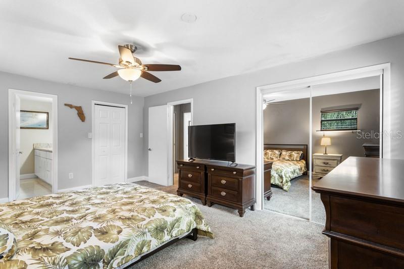 WHETHER YOU ARE SEEKING A TRANQUIL RETREAT OR A FUNCTIONAL SPACE TO PREPARE FOR THE DAY AHEAD, THIS PRIMARY BEDROOM, COMPLETE WITH A WALK IN CLOSET PLUS AN ADDITIONAL LARGE CLOSET AND PRIVATE, FULL BATHROOM, FULFILLS EVERY DESIRE.