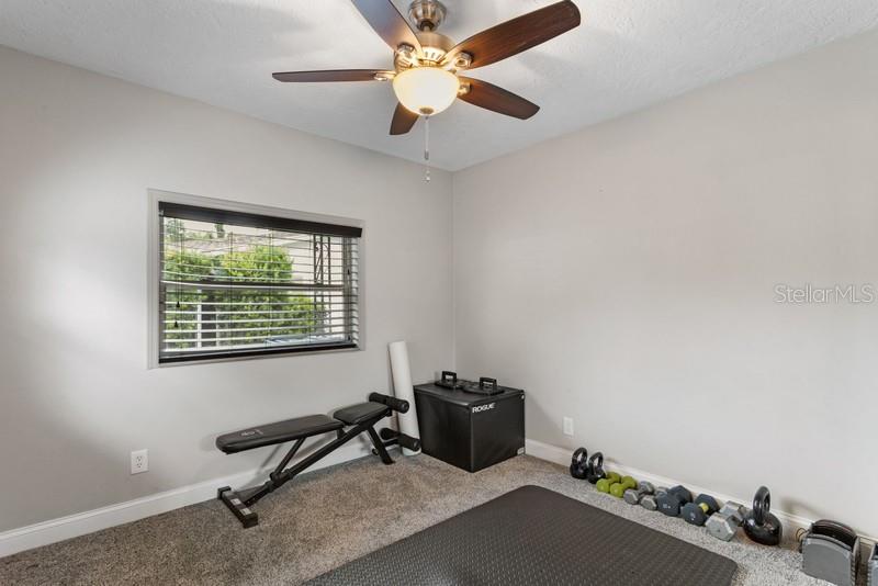 THE SECOND BEDROOM, CURRENTLY USED AS A WORK OUT ROOM, IS SPACIOUS.