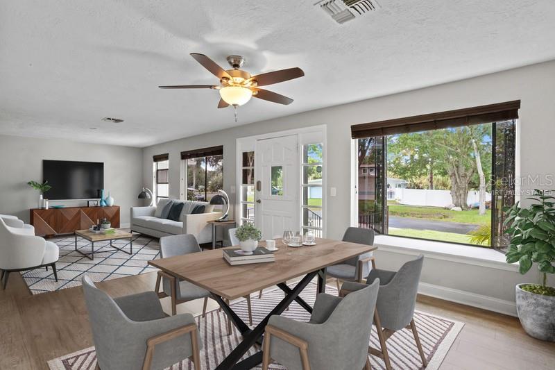 THE LIVING & DINING ROOM COMBINATION IS PERFECTLY DESIGNED WITH PEACEFUL VIEWS OF LAKE IBIS.  (Virtually Staged).