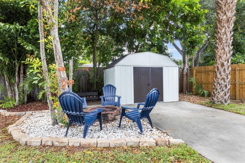 RELAX AROUND THE FIRE PIT.  THE SHED OFFERS ROOM FOR TOOLS, EQUIPMENT AND MORE.