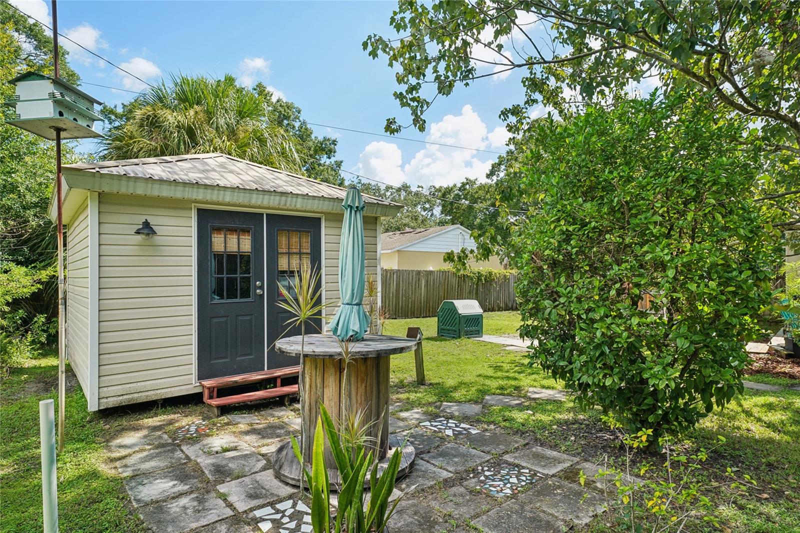 Air conditioned shed and paved patio