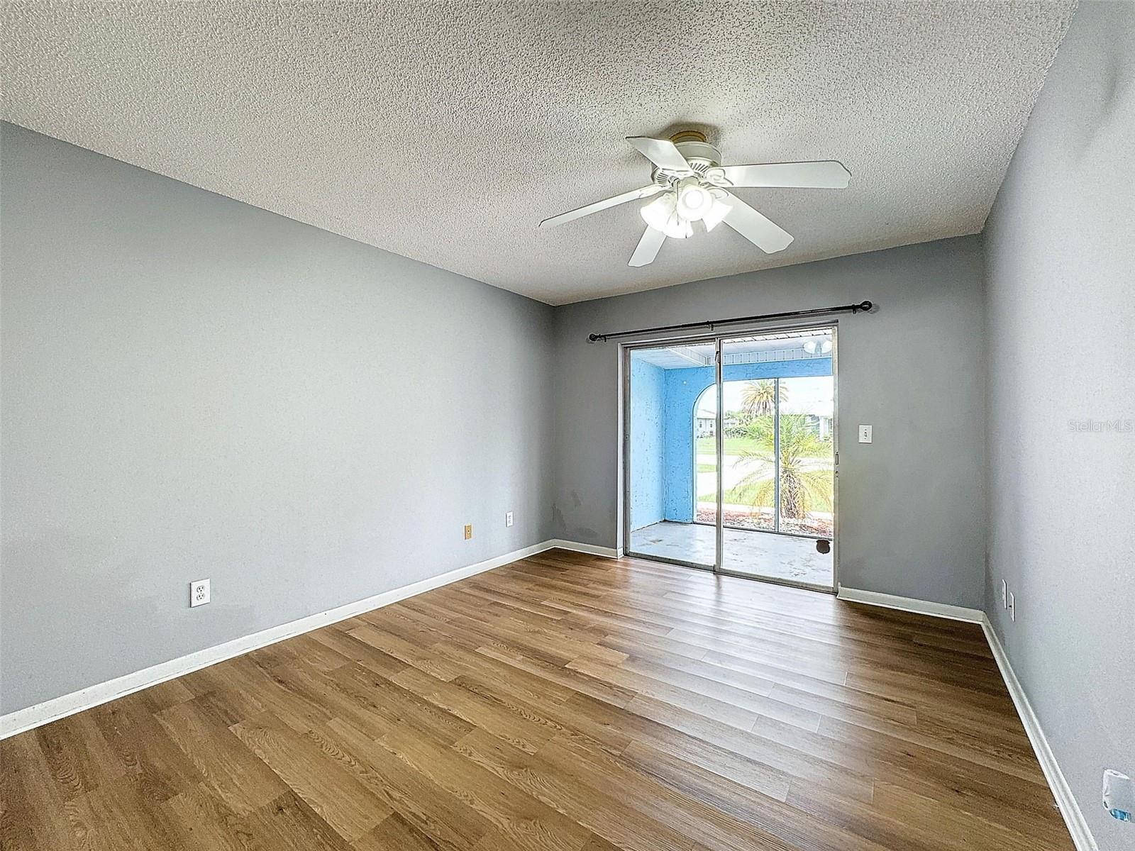 Primary Bedroom with sliding glass doors to front porch