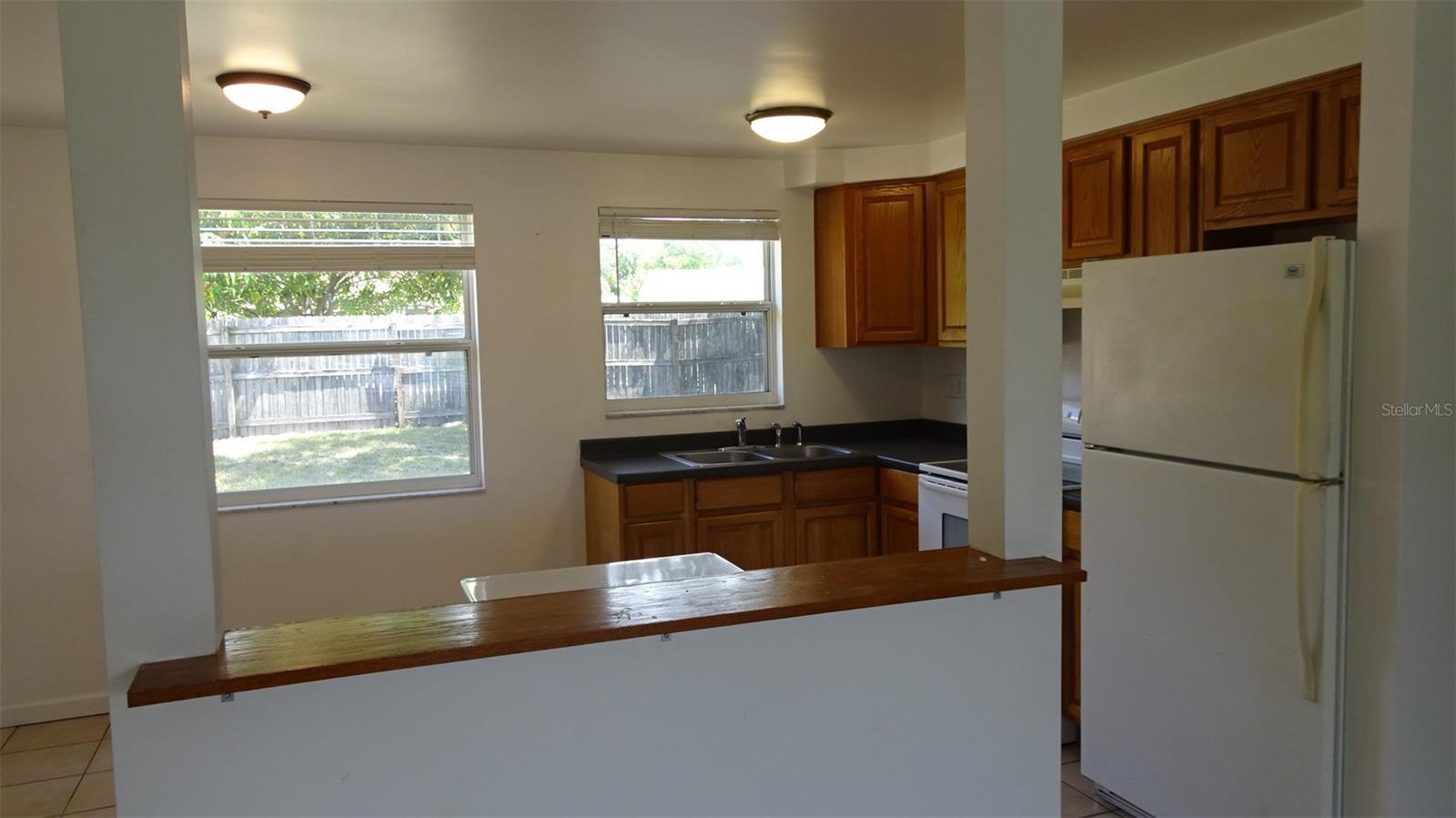 Small bar separating the living area from the kitchen area.