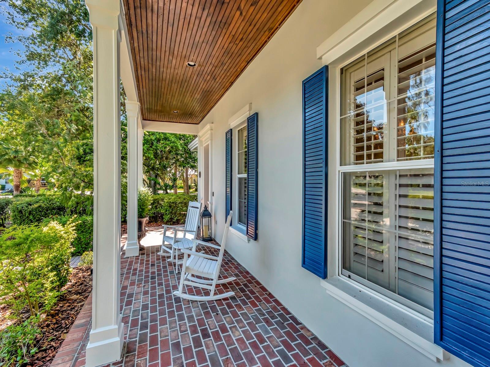 Relax on Front porch overlooking Landscaped lawn