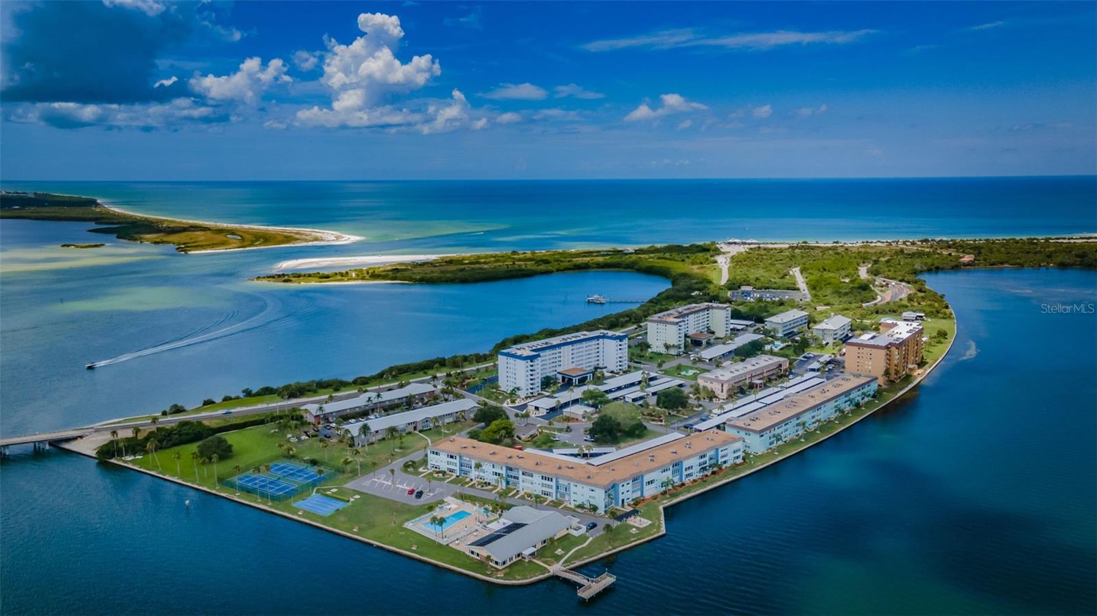 Aerial view of community and Honeymoon Island