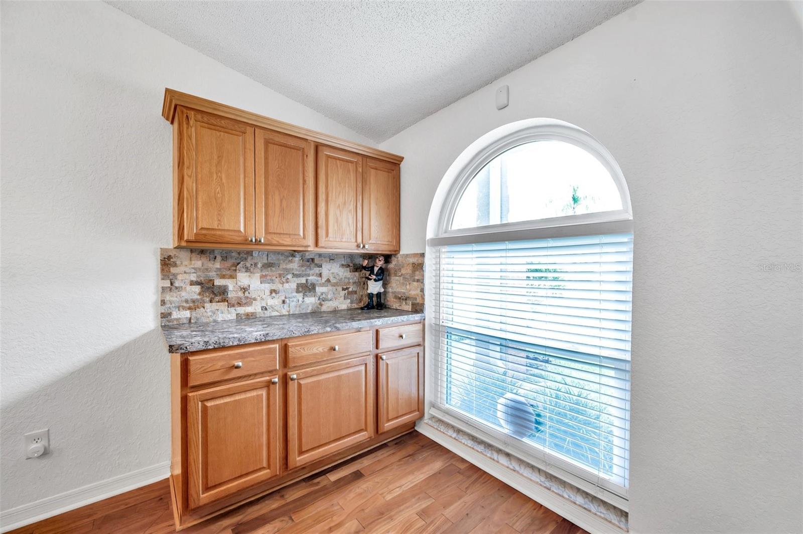 This extra cabinet station would make a perfect coffee bar. Large picture window lets in an abundance of light.