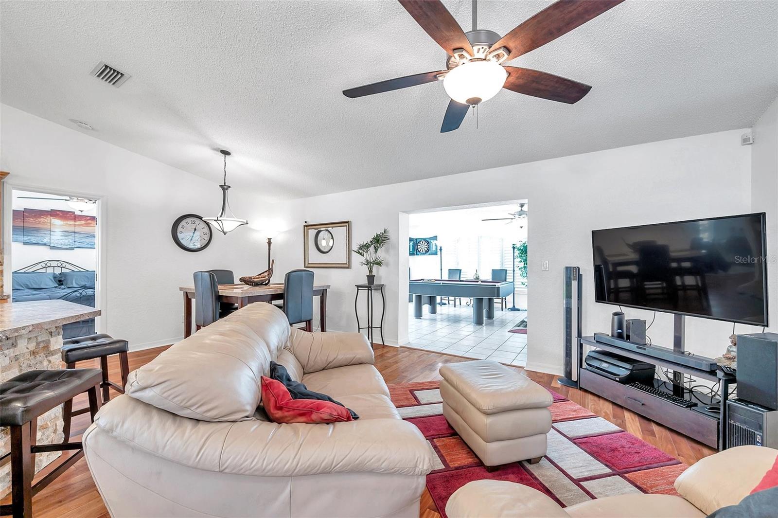 The living room/great room setup allows for comfy gatherings with family and friends.