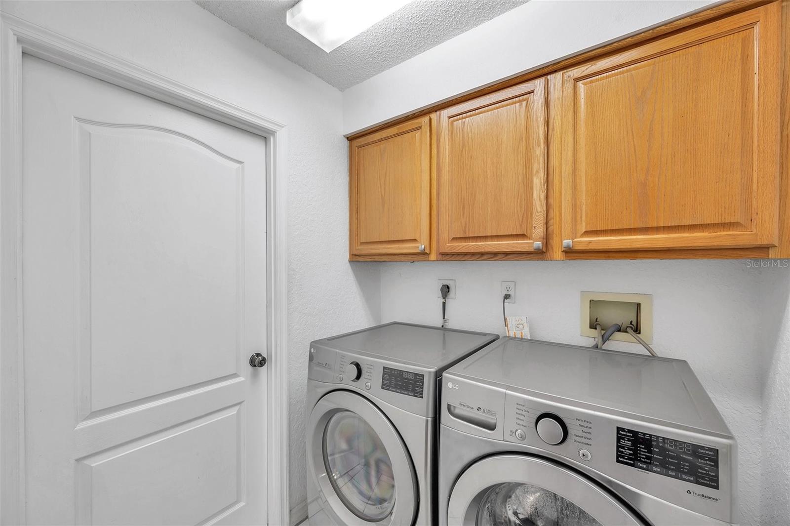 The laundry room leads to the large 3-car garage; perfect to store your cars, toys, golf cart, etc.