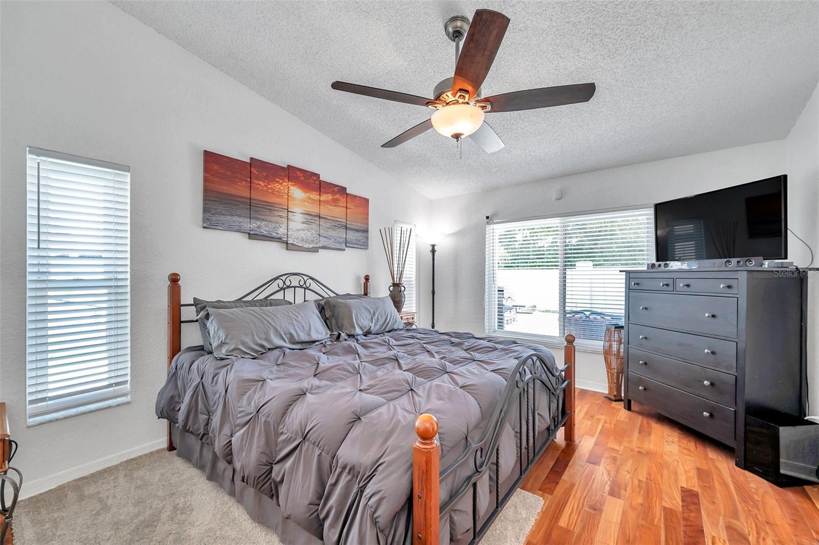 The large primary has room for a king-size bed and all of your furniture.