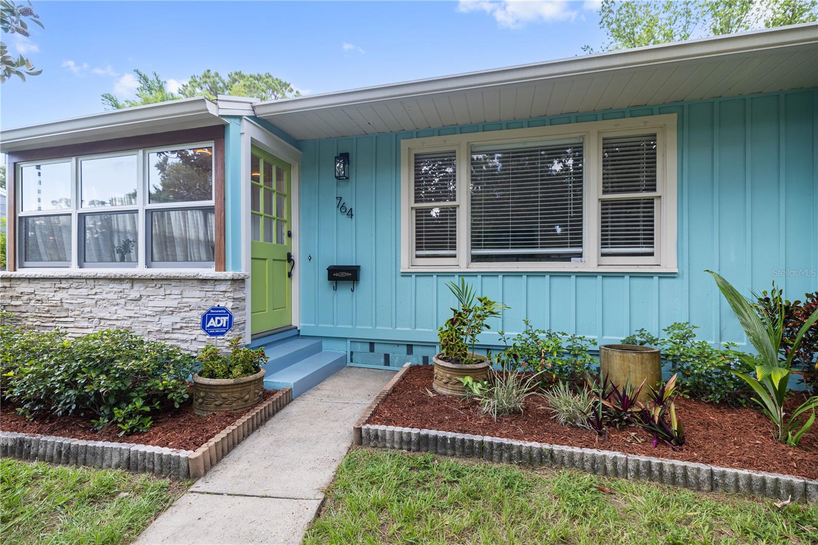 Freshly Painted Exterior and Lush Landscaping for great curb appeal.