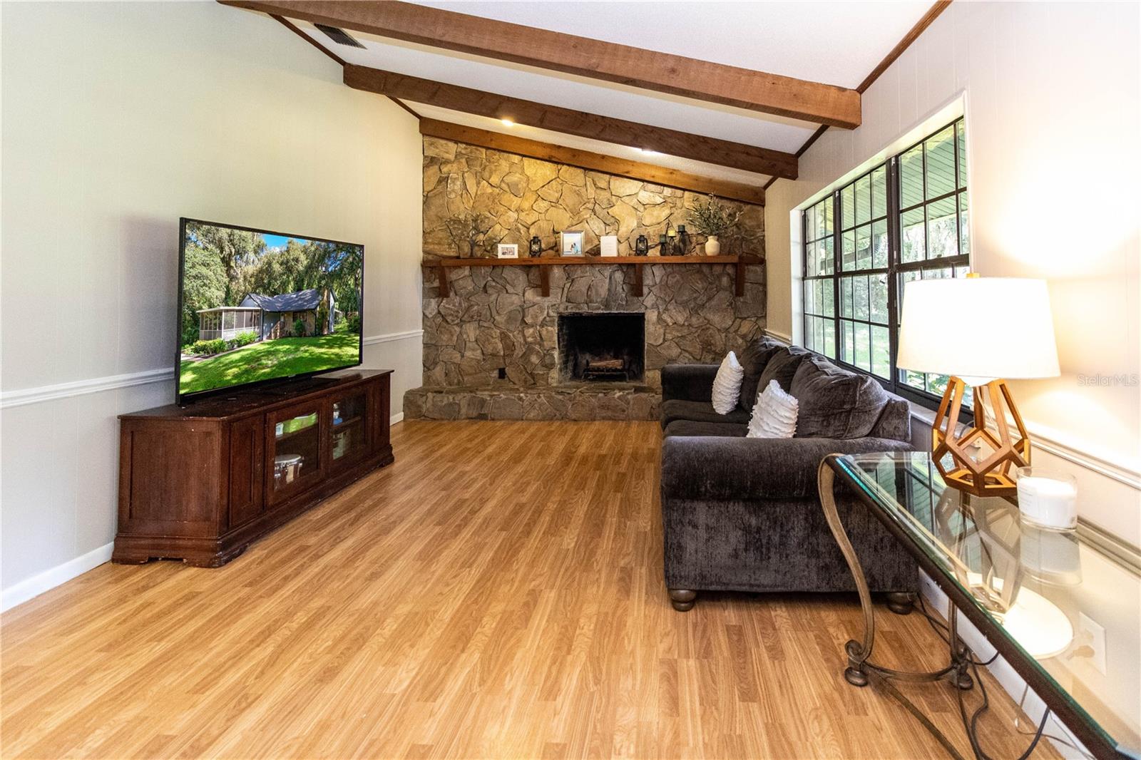 Living room with stone fireplace