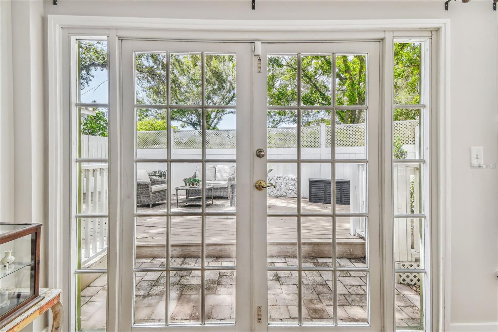 French doors leading from the Florida room  to the outdoor deck