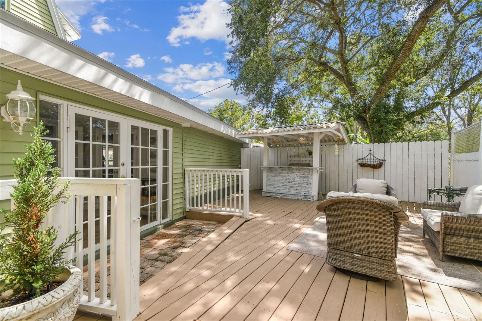 Large wooden deck with dry bar