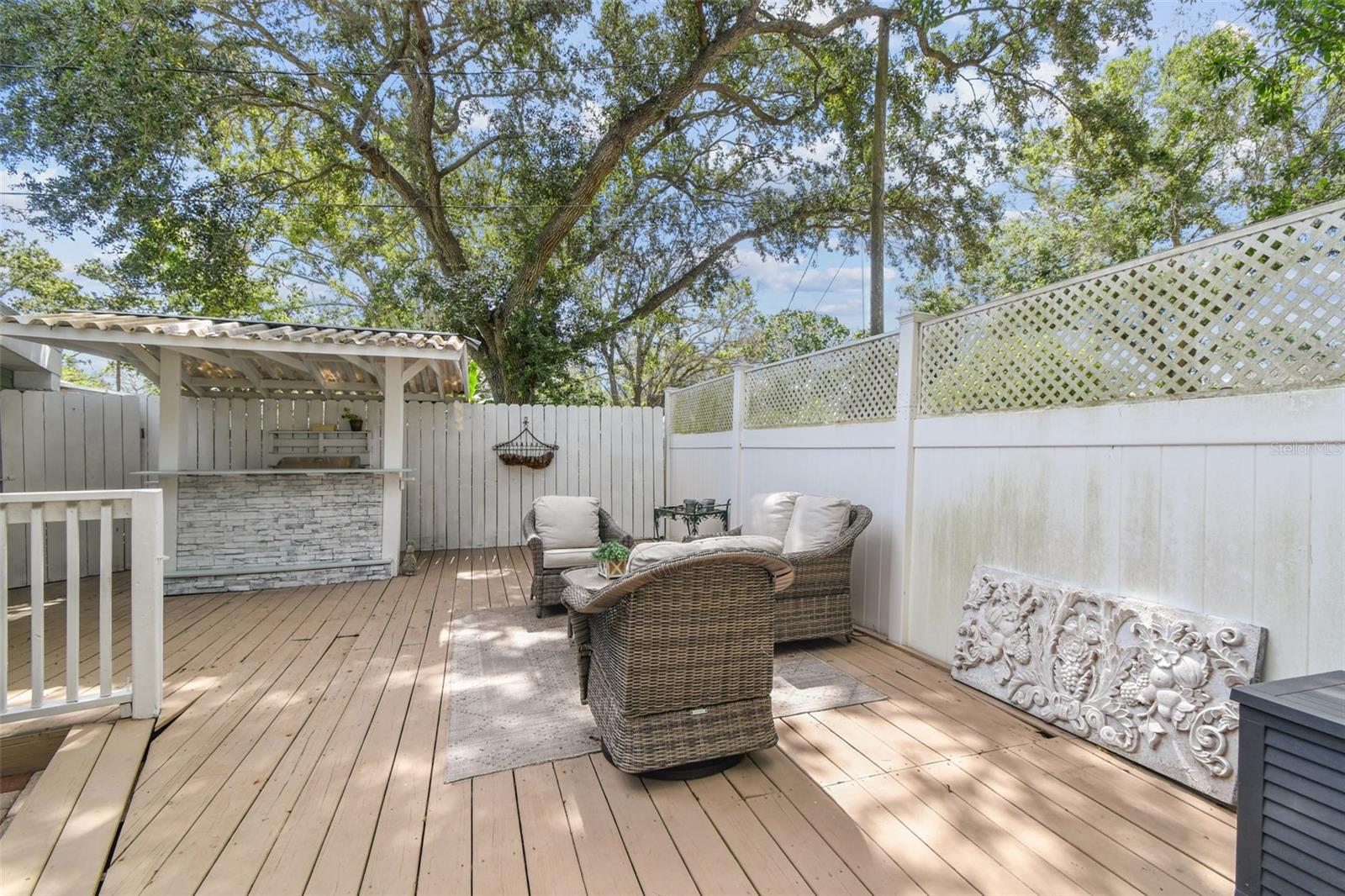 Large wooden deck with dry bar