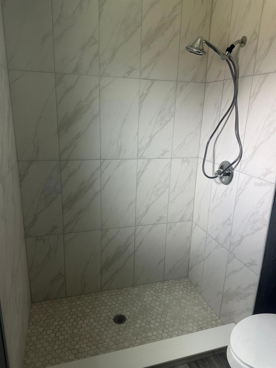 Standing shower in main bathroom was fully renovated.