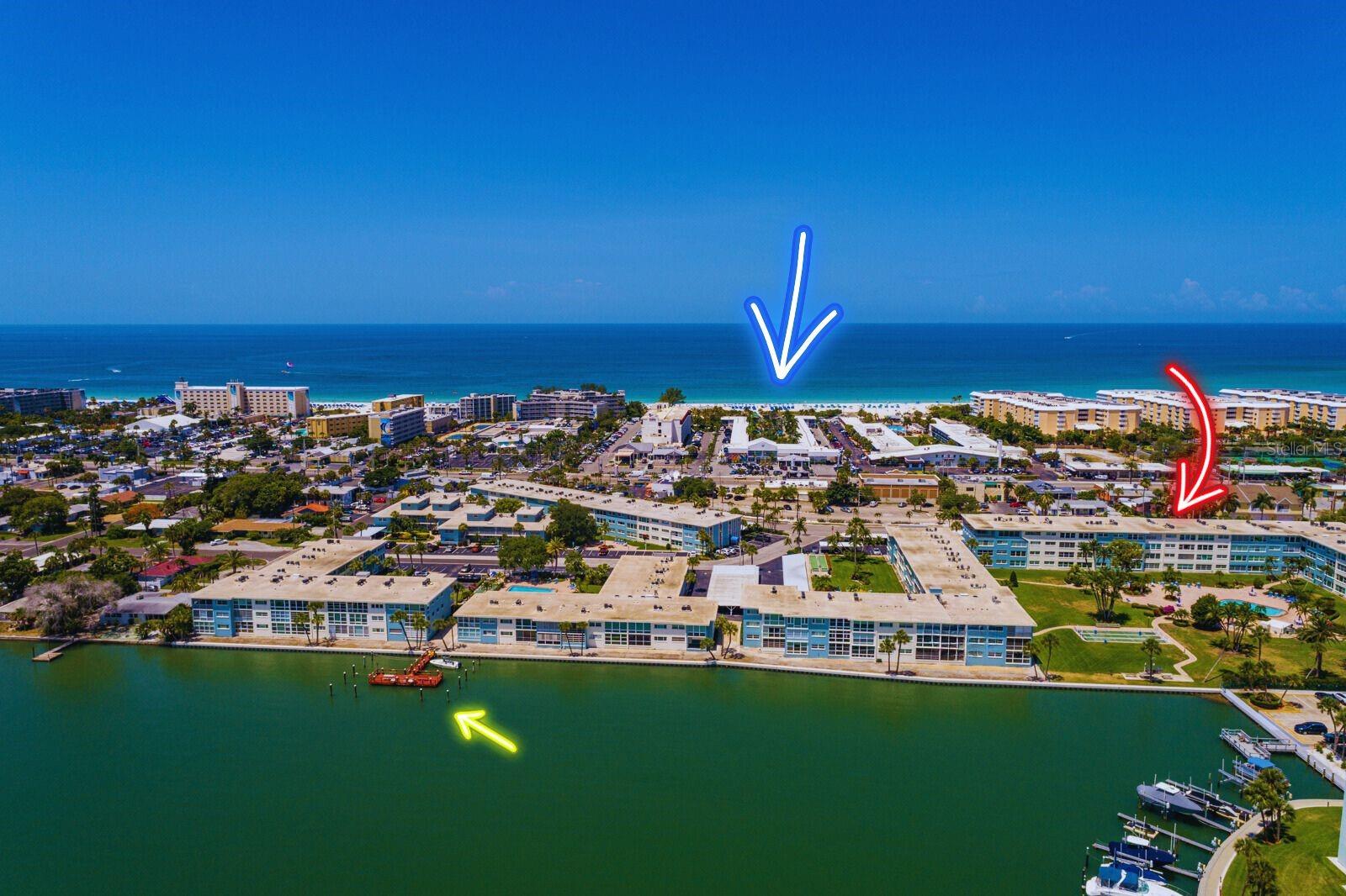 Fishing pier, Unit 131(red arrow) & beach on Gulf of Mexico.