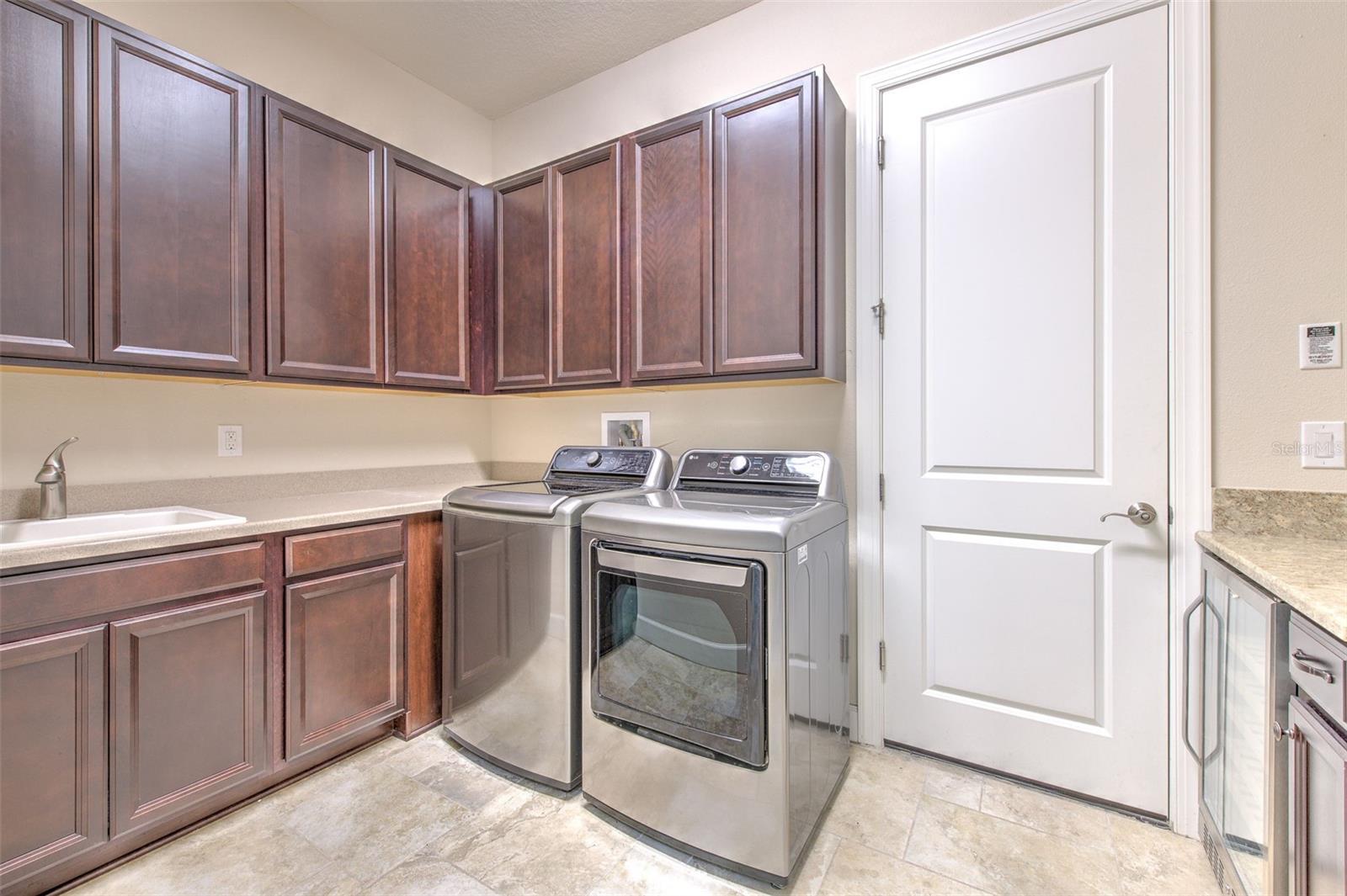 Huge Laundry Room with lots of shelving & built in WINE FRIDGE!