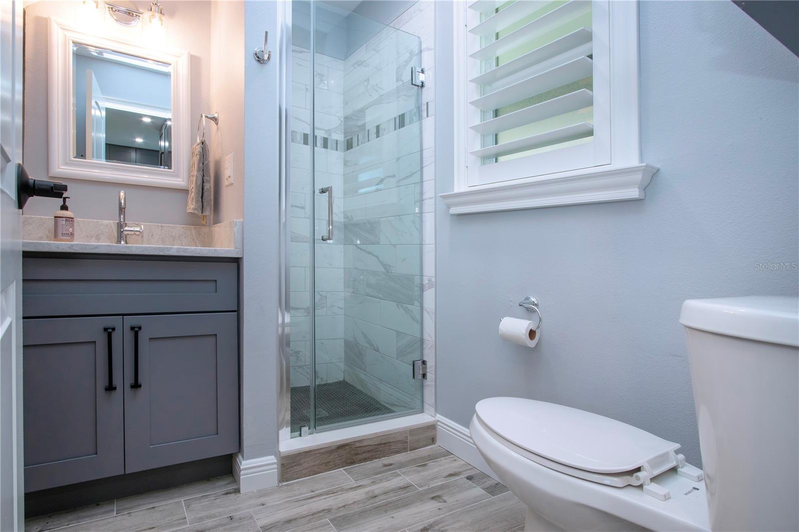 Remodeled Bathroom with Tiled Walk-in Shower