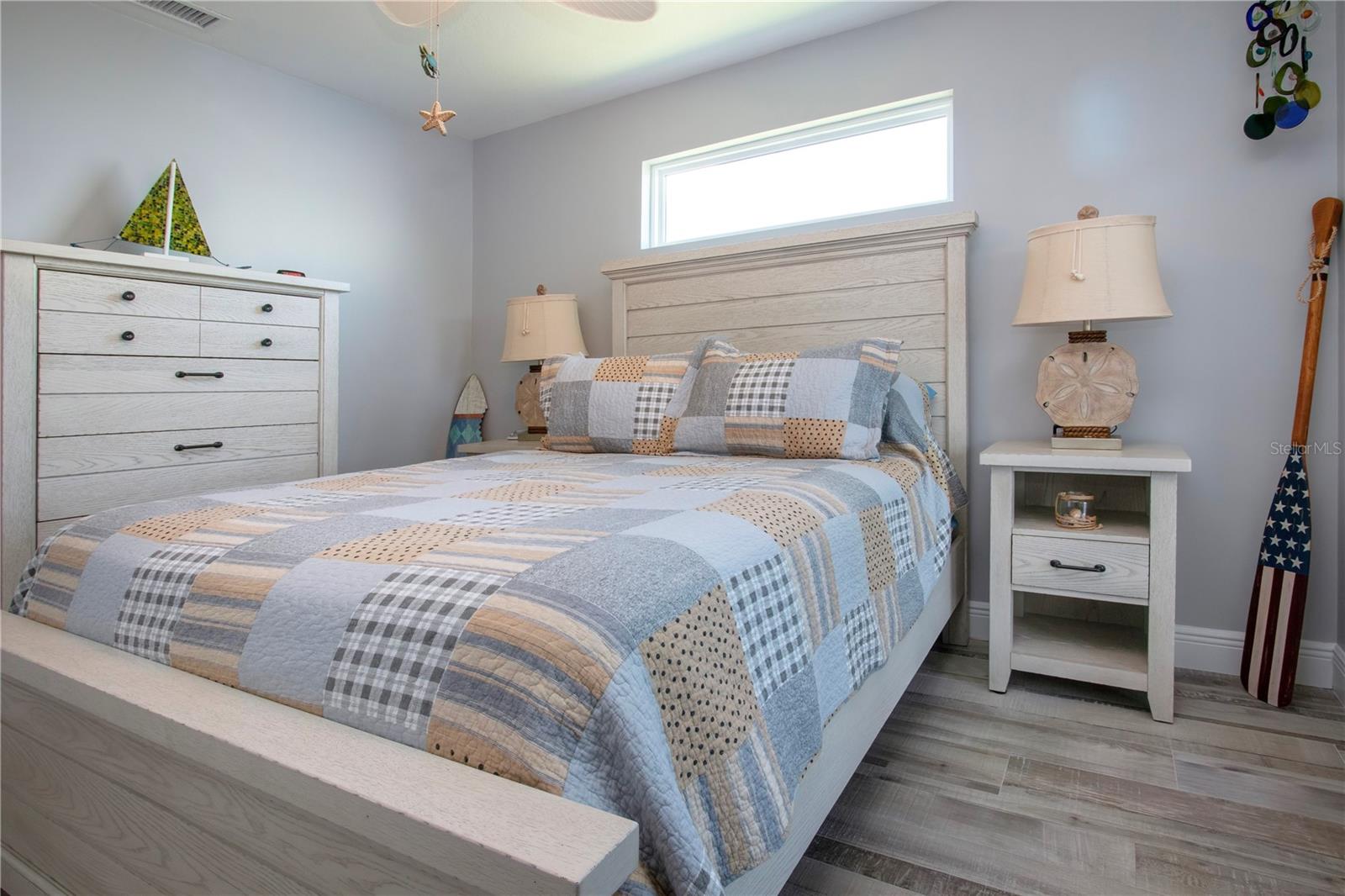 Primary Bedroom with Tile Floors and Ceiling Fan