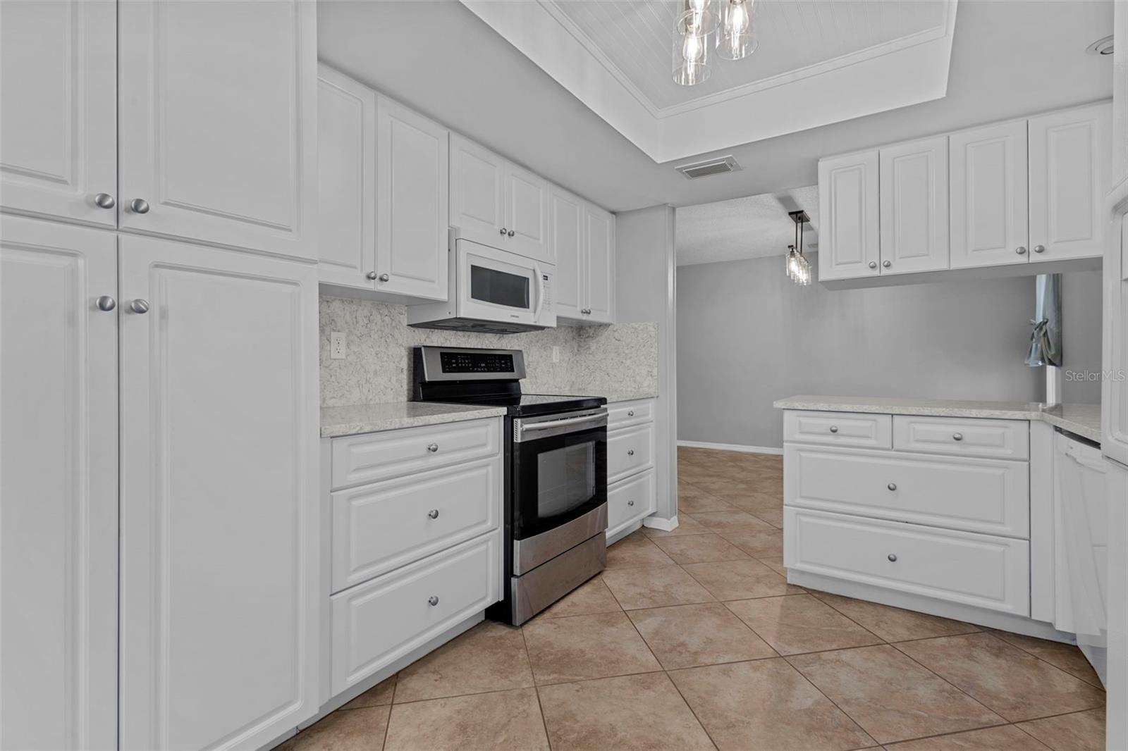 Updated kitchen with plentiful cabinets