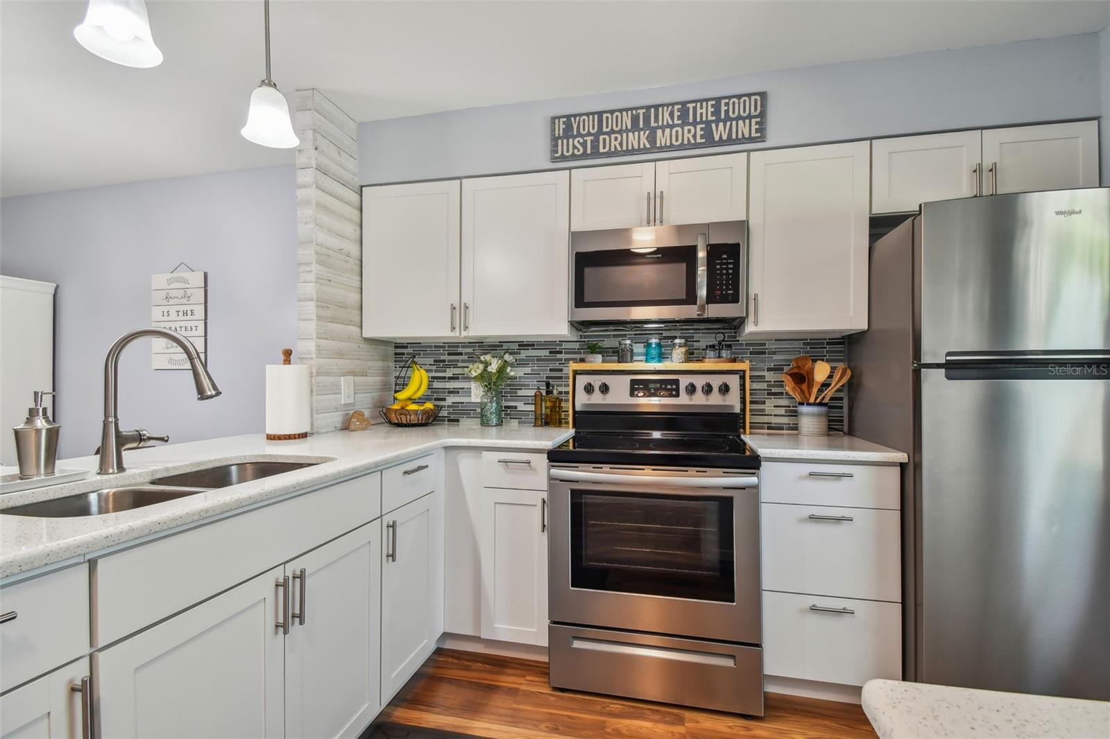 Updated kitchen, backsplash and lighting.