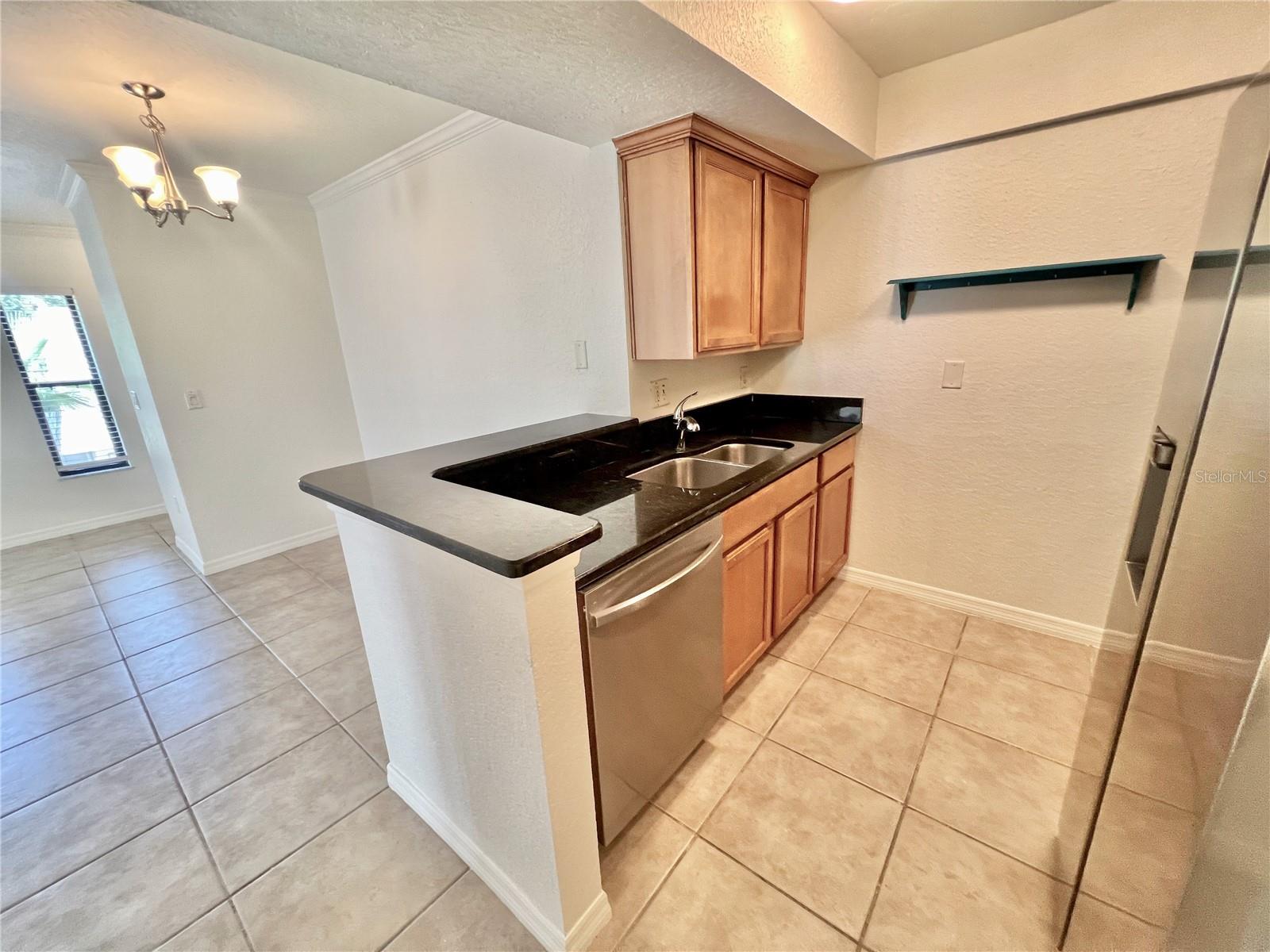 Spacious kitchen with granite counters & brand new stainless appliances