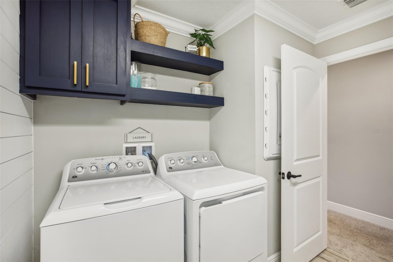 Upstairs Laundry/utility room with customized cabinetry