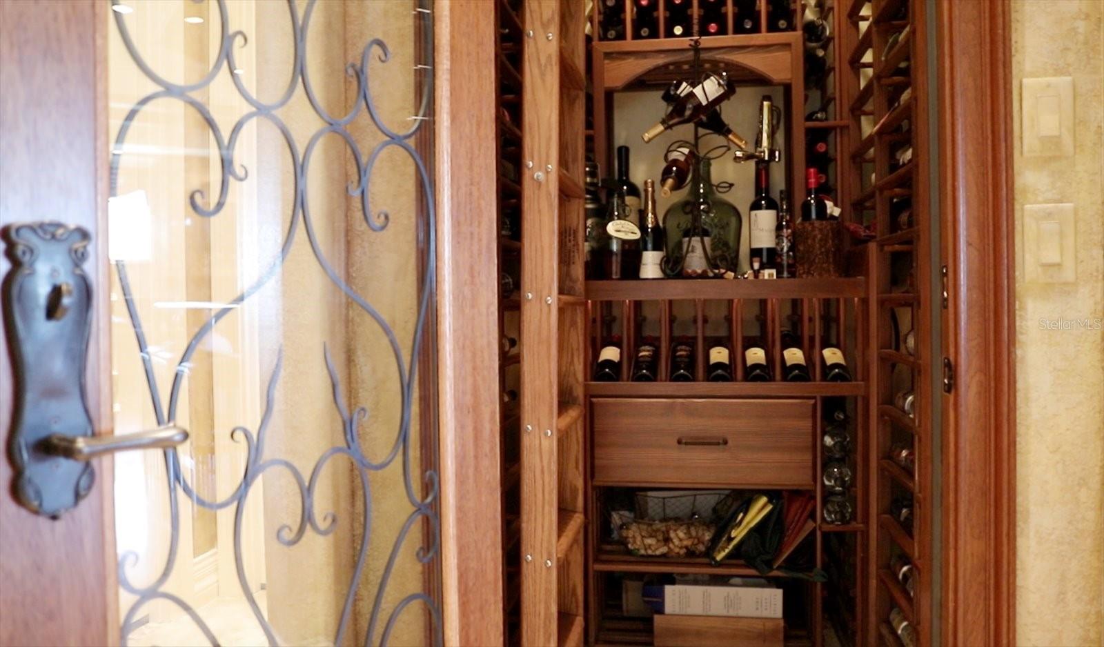 350-bottle wine room with built-in cigar humidor, & custom temperature controls