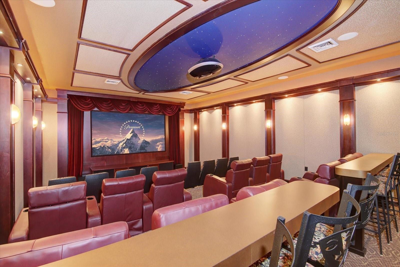 Theater Room professionally designed, built and sound-proofed, has 3 tiers of custom leather recliner seating for 20, plus bar seating for 8, constellation ceiling, surround sound, acoustic paneling, 10’x6’ screen, wet bar, & refrigerator