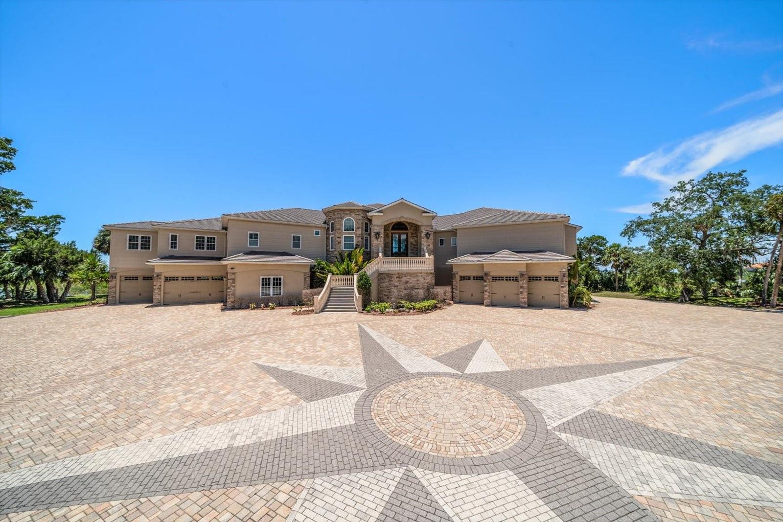 Over 30,000 sf brick paver motor court with Nautical Star design