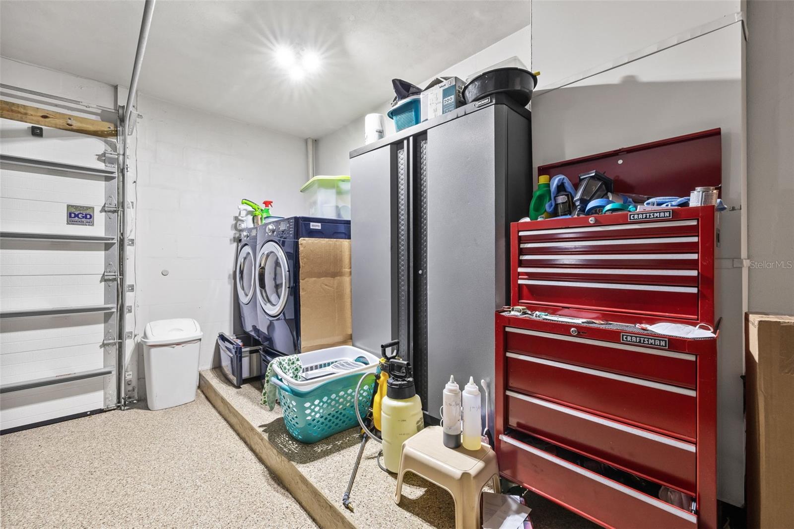 Laundry located in the single car garage.