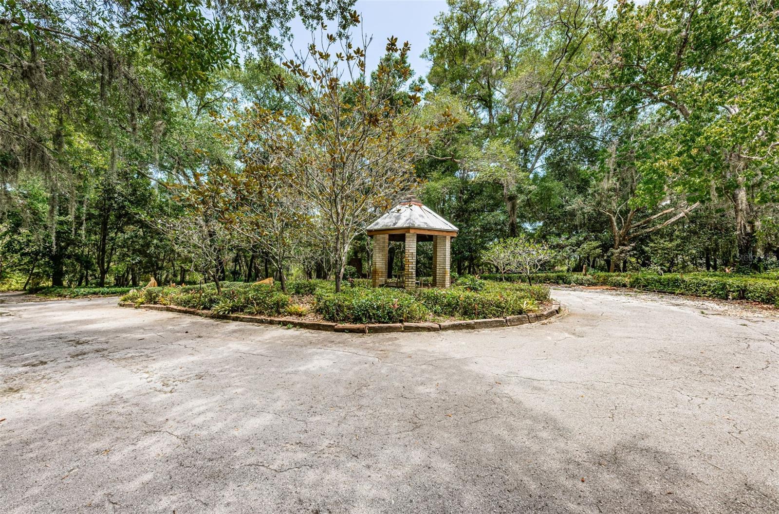 Circle driveway that leads to 2 car garage