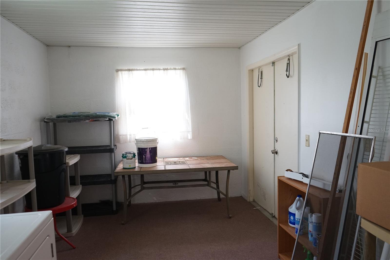 laundry room has space for golf cart, bikes and beach gear