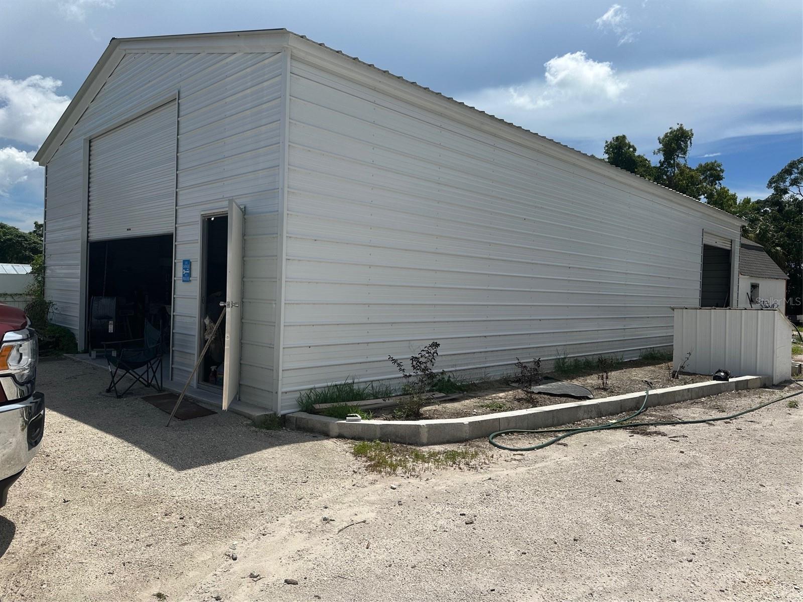 GARAGE ; 12 FT WIDE DOOR IN FRONT AND ANOTHER 10FT DOOR  IN BACK