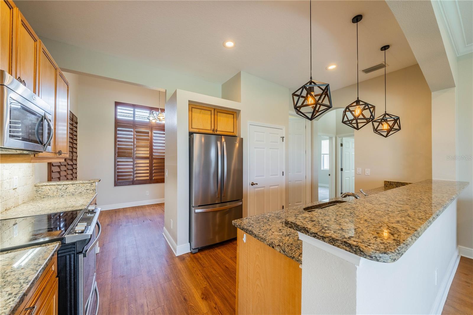 UPGRADED CABINETS WITH GRANITE COUNTER TOPS