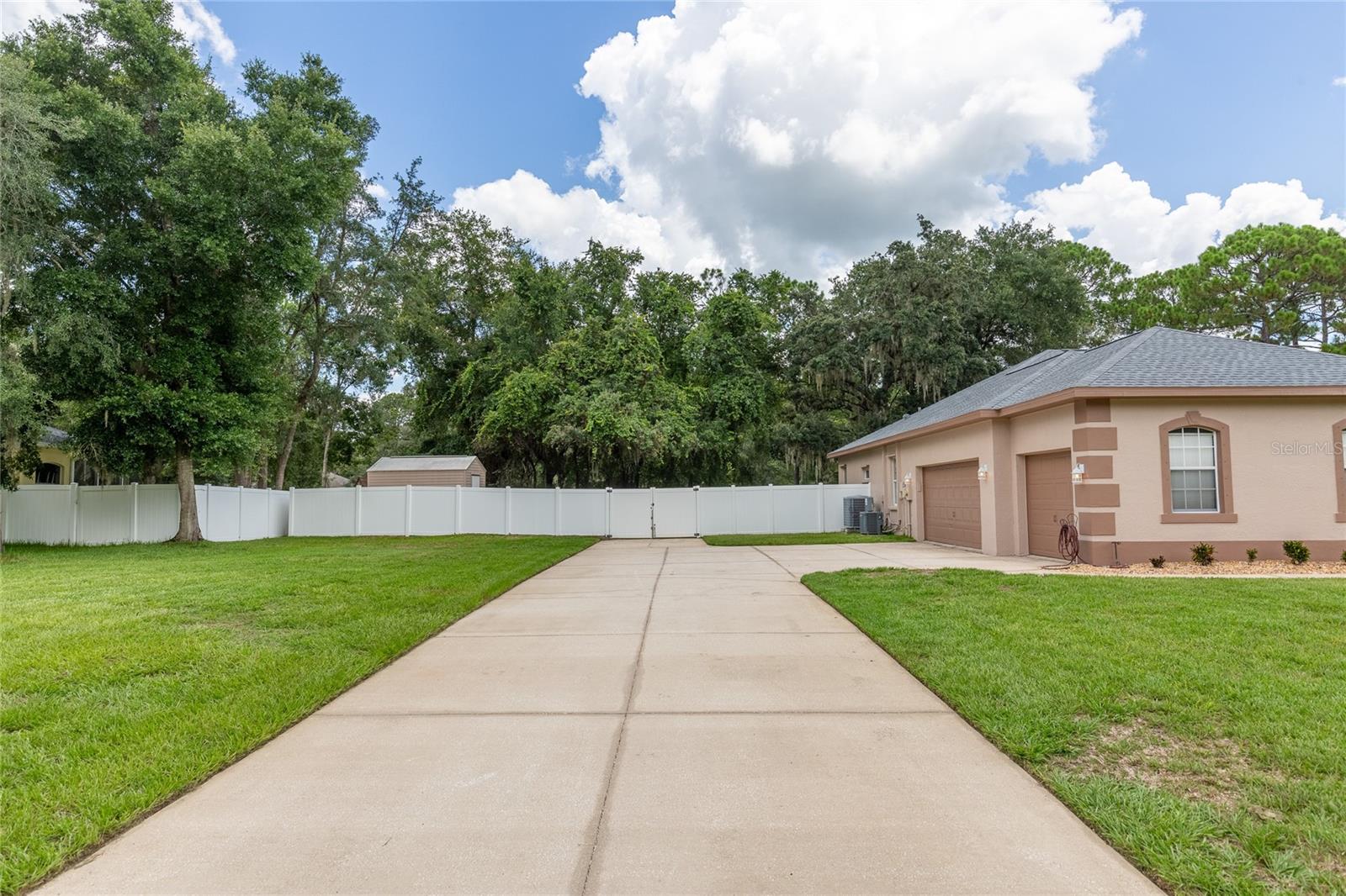 56 Ft. of Driveway to the fence!