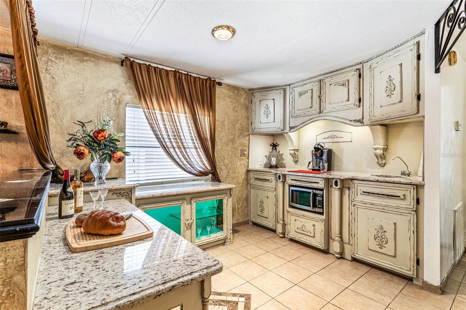 Breakfast Area with Wet Bar and Built In Cabinets