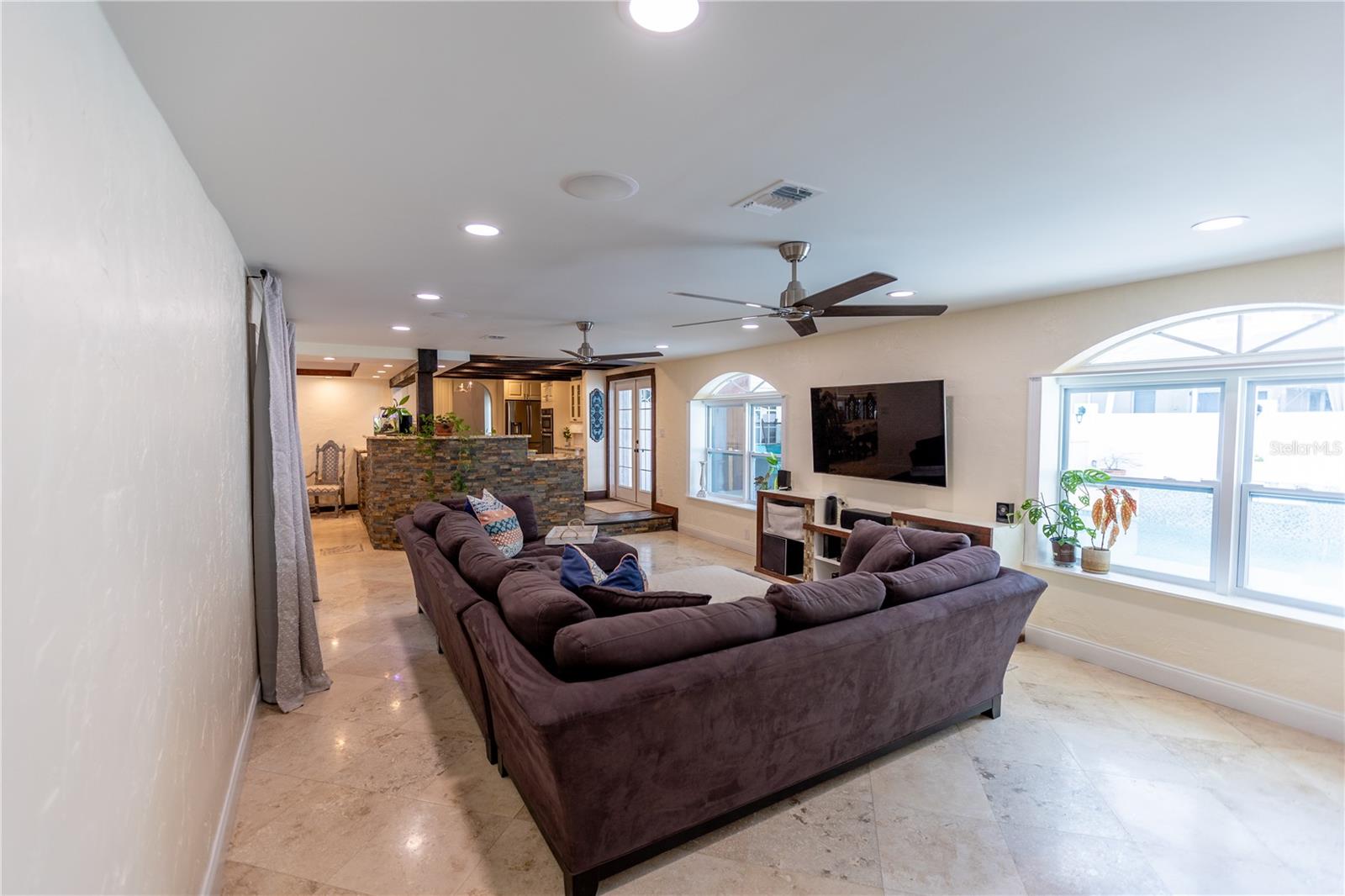 LIVING ROOM FACING KITCHEN AND DINING ROOM