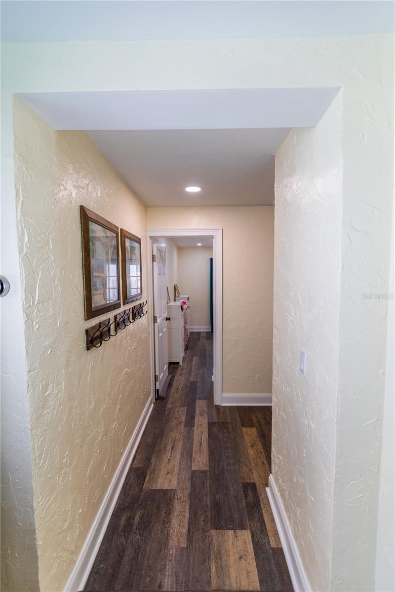 LIVING ROOM HALLWAY TO BEDROOM AND LAUNDRY ROOM