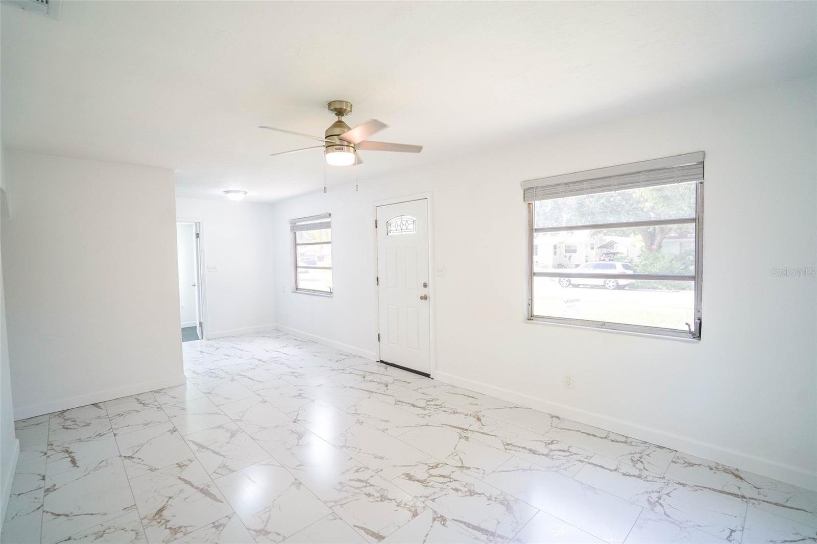 View of front door from corner of living room