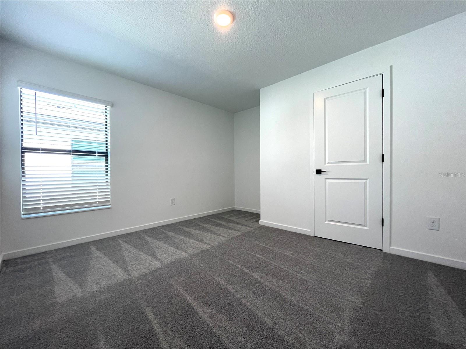 guest bedroom two with a nook for a desk